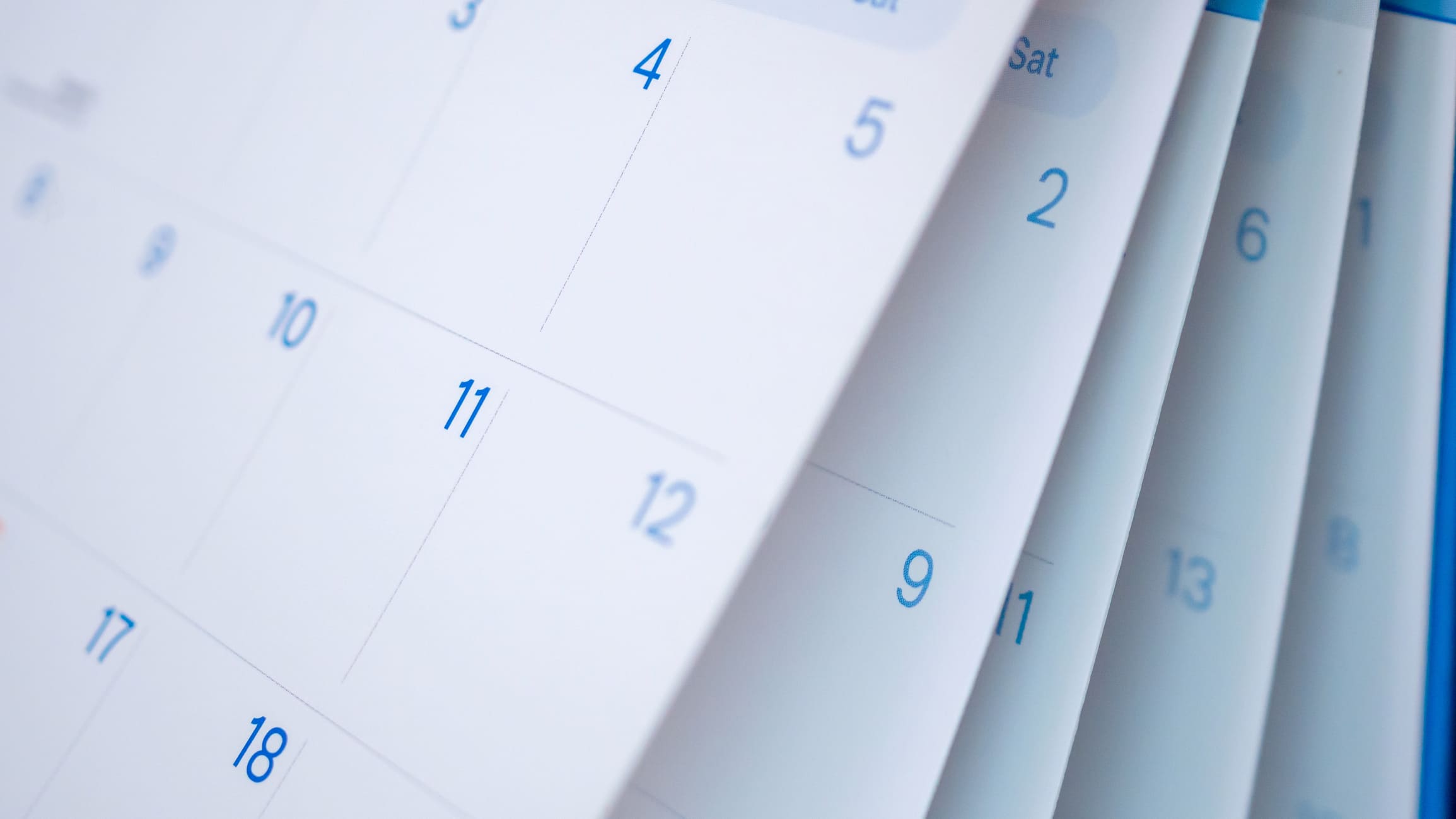 Close-up of a calendar showing passing days to illustrate the divorce cooling-off period and timeline in England and Wales